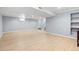 Spacious basement with neutral walls, wood floors, and recessed lighting offers a versatile living space at 4860 S Field Way, Littleton, CO 80123