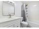 Well-lit full bathroom with a shower-tub and vanity with storage space at 4860 S Field Way, Littleton, CO 80123