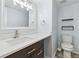 Bathroom featuring modern fixtures, vanity with white countertop, and toilet at 4860 S Field Way, Littleton, CO 80123