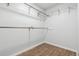 Walk-in closet with wooden floors, white walls, and metal racks along the top at 4860 S Field Way, Littleton, CO 80123