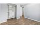 A walk-in closet with white shelves, fresh paint, hardwood floors, and lots of storage at 4860 S Field Way, Littleton, CO 80123