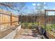 Backyard garden featuring wooden beds, brick pathways, and vibrant greenery at 4860 S Field Way, Littleton, CO 80123
