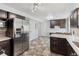 Spacious kitchen features stainless appliances and quartz countertops at 4860 S Field Way, Littleton, CO 80123