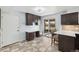 Eat-in kitchen features a sliding glass door leading to a fenced yard at 4860 S Field Way, Littleton, CO 80123