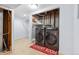 This laundry room features modern washer and dryer units, complemented by a rustic 'Laundry Room' rug at 4860 S Field Way, Littleton, CO 80123