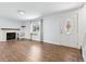 Bright and airy living room featuring wood floors, a fireplace, and a decorative front door at 4860 S Field Way, Littleton, CO 80123