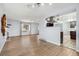 Bright open-concept living room with hardwood floors and view to kitchen at 4860 S Field Way, Littleton, CO 80123