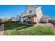 Enjoy a lush green backyard with a cozy covered patio, perfect for outdoor relaxation and entertaining at 6021 Lynx Creek Cir, Erie, CO 80516