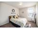 Cozy bedroom features natural light and a comfortable bed with decorative pillows at 6021 Lynx Creek Cir, Erie, CO 80516