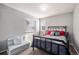 Bedroom with natural light, a comfortable bed and a stylish daybed for lounging at 6021 Lynx Creek Cir, Erie, CO 80516