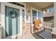Cozy front porch with a welcome mat, wooden bench, and cheerful wreath adorning the entry door at 6021 Lynx Creek Cir, Erie, CO 80516