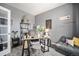 Inviting home office featuring a modern desk, stylish decor, and a comfortable lounge area at 6021 Lynx Creek Cir, Erie, CO 80516