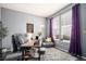 Comfortable home office with a desk, cozy seating area, and natural light from the windows at 6021 Lynx Creek Cir, Erie, CO 80516