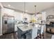 Modern kitchen boasts stainless steel appliances, granite countertops, and ample cabinet space at 6021 Lynx Creek Cir, Erie, CO 80516