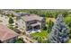 Overhead shot of property shows fenced yard, mature trees, patio, and outdoor seating area at 3890 Tabor Ct, Wheat Ridge, CO 80033
