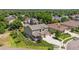 Spacious home with lush green landscaping, a fenced yard, and a large driveway at 3890 Tabor Ct, Wheat Ridge, CO 80033