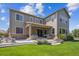 Backyard exterior featuring covered patio, outdoor seating area, planter boxes, and fenced yard at 3890 Tabor Ct, Wheat Ridge, CO 80033