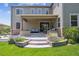 Backyard featuring a covered patio with an outdoor seating area and a raised planter box at 3890 Tabor Ct, Wheat Ridge, CO 80033