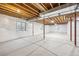 Unfinished basement ready for customization, featuring exposed beams and insulated walls at 3890 Tabor Ct, Wheat Ridge, CO 80033