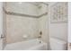 Bright bathroom with a tiled shower and a bathtub at 3890 Tabor Ct, Wheat Ridge, CO 80033
