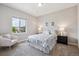 Inviting bedroom with a large window and comfortable furniture at 3890 Tabor Ct, Wheat Ridge, CO 80033
