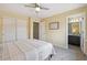 Comfortable bedroom featuring an attached bathroom and closet at 3890 Tabor Ct, Wheat Ridge, CO 80033