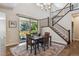 Dining area with sliding door to the backyard and stairs leading to the second floor at 3890 Tabor Ct, Wheat Ridge, CO 80033