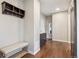Entryway featuring wood floors, bench, coat rack and a built-in cabinet at 3890 Tabor Ct, Wheat Ridge, CO 80033