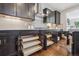 Kitchen dark wood cabinets with pull out drawers offer storage and easy access to contents at 3890 Tabor Ct, Wheat Ridge, CO 80033