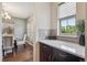Bright kitchen featuring a white countertop and stainless steel appliances; backsplash and window provide natural light at 3890 Tabor Ct, Wheat Ridge, CO 80033