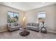 Bright living room with neutral tones, carpet, and large windows at 3890 Tabor Ct, Wheat Ridge, CO 80033