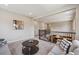 Open living space featuring carpet, staircase, and contemporary decor at 3890 Tabor Ct, Wheat Ridge, CO 80033