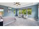 Primary bedroom featuring a tray ceiling, and several large windows at 3890 Tabor Ct, Wheat Ridge, CO 80033