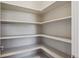 Pantry with built-in shelving provides ample storage for all of your food storage needs at 3890 Tabor Ct, Wheat Ridge, CO 80033
