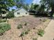 Landscaped front yard with garden, offering potential for outdoor enjoyment and curb appeal at 444 S Jersey St, Denver, CO 80224