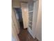 Hallway shows built-in shelving and storage adjacent to a secondary room with neutral carpet and paint at 444 S Jersey St, Denver, CO 80224