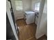 This laundry room features a door to the backyard, window, and a washer at 444 S Jersey St, Denver, CO 80224