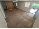 Bright living room featuring a combination of carpet and hardwood flooring and a large window at 444 S Jersey St, Denver, CO 80224
