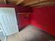 This storage room features red-painted walls and exposed wood at 444 S Jersey St, Denver, CO 80224