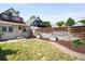 Private backyard with a lawn, flower bed and a modern horizontal fence at 3375 W 37Th Ave, Denver, CO 80211