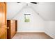 This bedroom features carpeted floors, a window, a closet, and is painted white with a dark wooden door and trim at 3375 W 37Th Ave, Denver, CO 80211