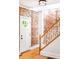 Hallway featuring exposed brick wall with staircase and beautiful hardwood flooring, with modern finishes at 3375 W 37Th Ave, Denver, CO 80211