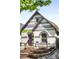 Charming home with unique architectural details, a cozy front porch, and a landscaped yard at 3375 W 37Th Ave, Denver, CO 80211