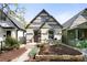 Charming home featuring a front patio, unique architectural details, and a well-maintained yard at 3375 W 37Th Ave, Denver, CO 80211