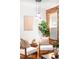 Living room featuring exposed brick wall, modern furniture, and stylish lighting at 3375 W 37Th Ave, Denver, CO 80211