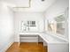 Bright office space featuring built-in desk, ample natural light, and painted brick accent wall at 3375 W 37Th Ave, Denver, CO 80211