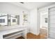 Bright home office with built in desk and shelves, hardwood floors, and exterior view at 3375 W 37Th Ave, Denver, CO 80211