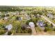 Aerial view showcases this home surrounded by lush greenery, outbuildings, and beautiful landscape at 5685 Columbine Ridge Rd, Elizabeth, CO 80107