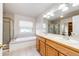 Bright bathroom with a double sink vanity, a separate shower and bathtub at 5685 Columbine Ridge Rd, Elizabeth, CO 80107