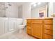 Bathroom featuring a walk in tub and updated vanity at 5685 Columbine Ridge Rd, Elizabeth, CO 80107